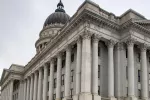 Exterior of Utah State Capitol on overcast day. 