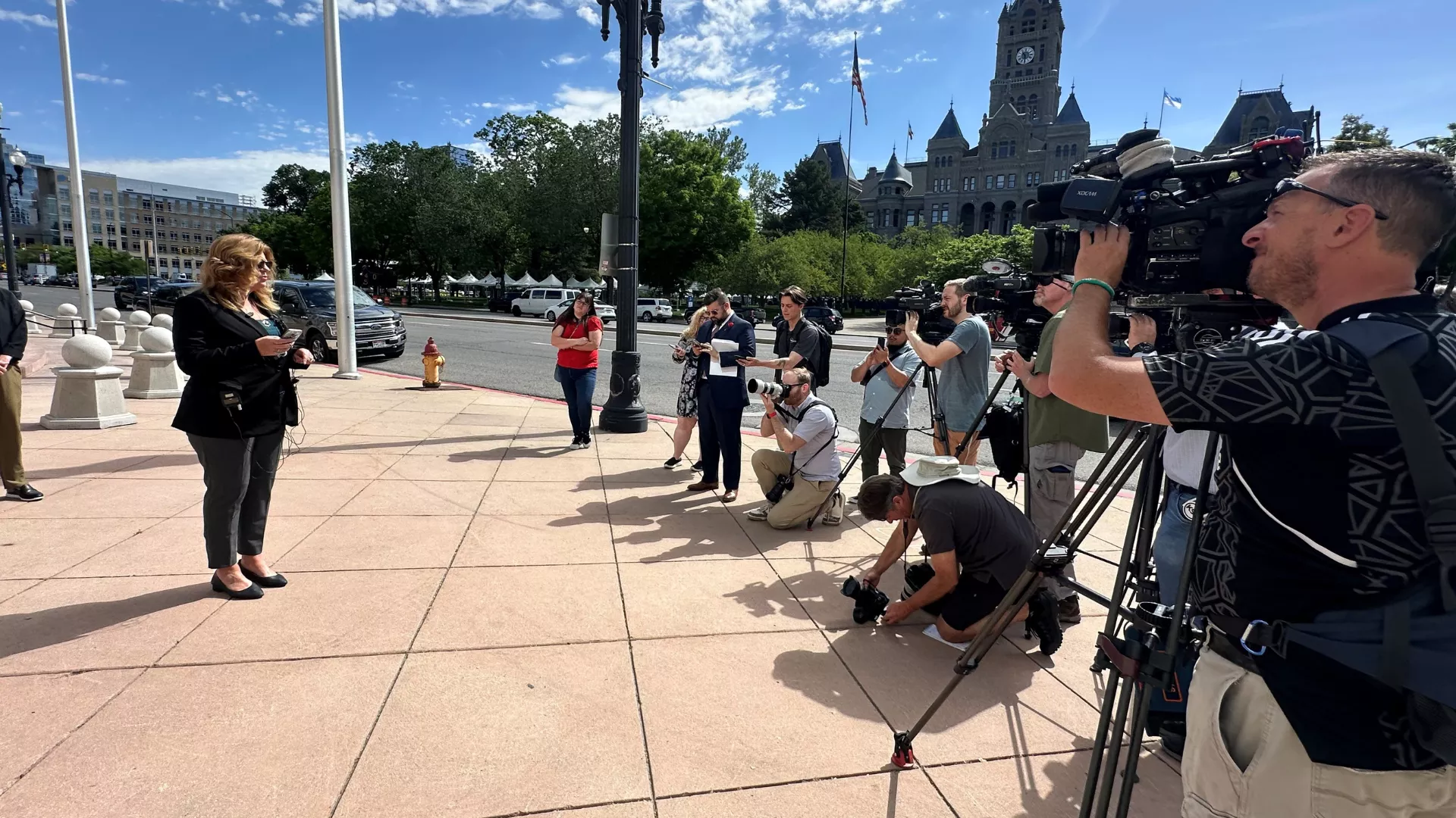 President Renée Pinkney speaks to large group of reporters.