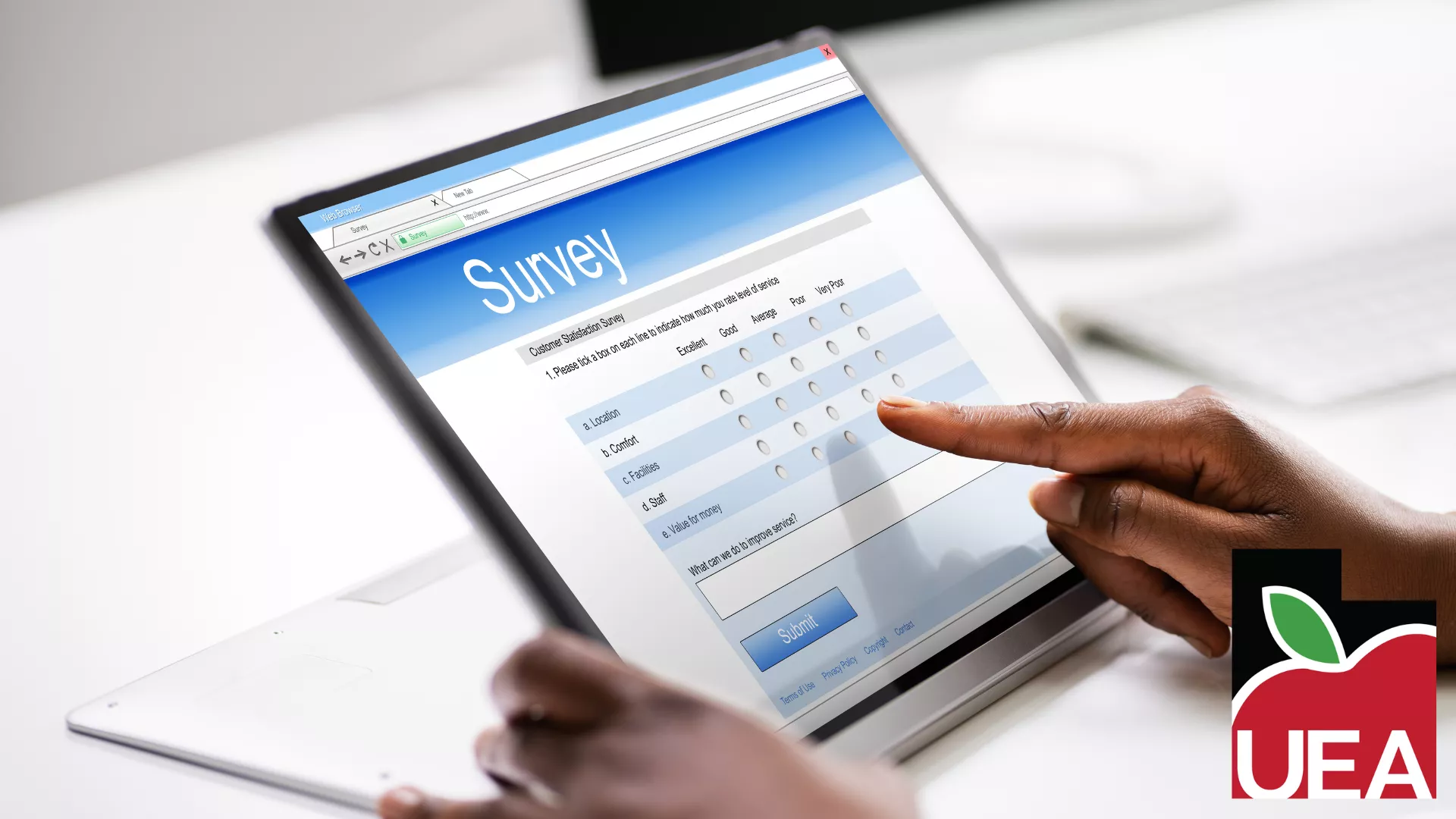 Tablet with the word "survey" written on it. 