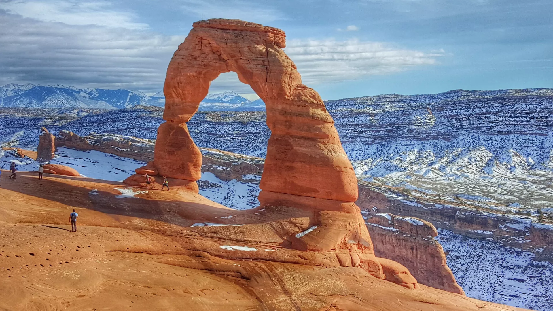 Utah Arch with snow in the background.