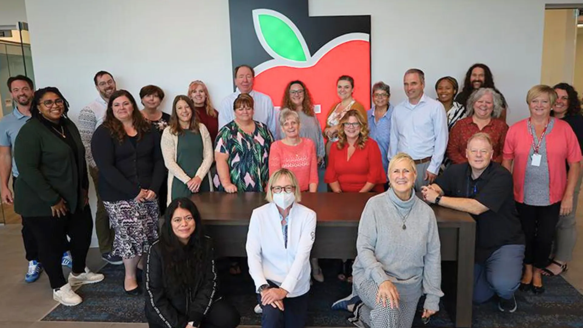 Group of UEA Staff smiling. 
