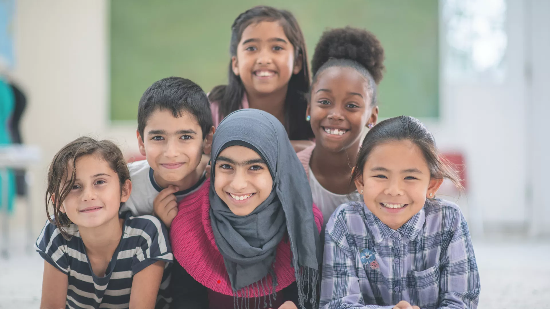 Group of children smiling.