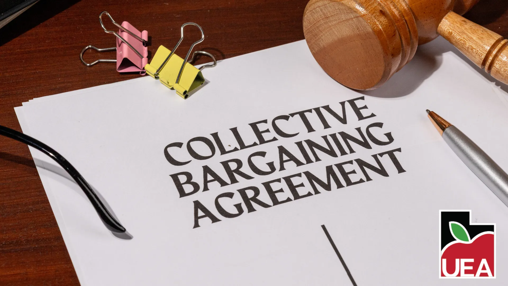 Photo of a paper that says collective bargaining agreement.