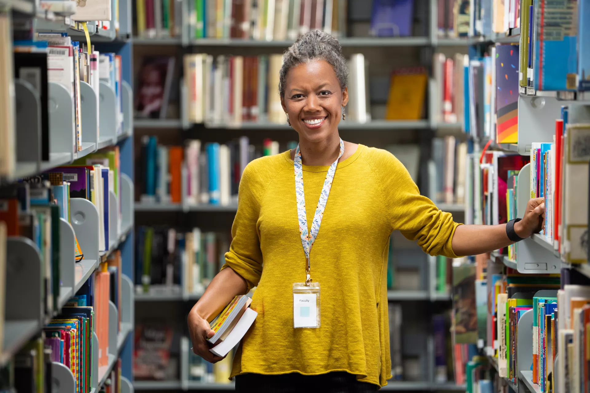Librarian with stack of books