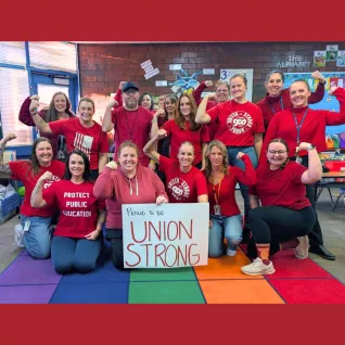 Group holds up Union Strong sign
