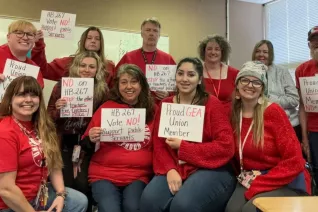 Group of people voting no.