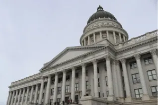 Utah capitol building under grey sky.