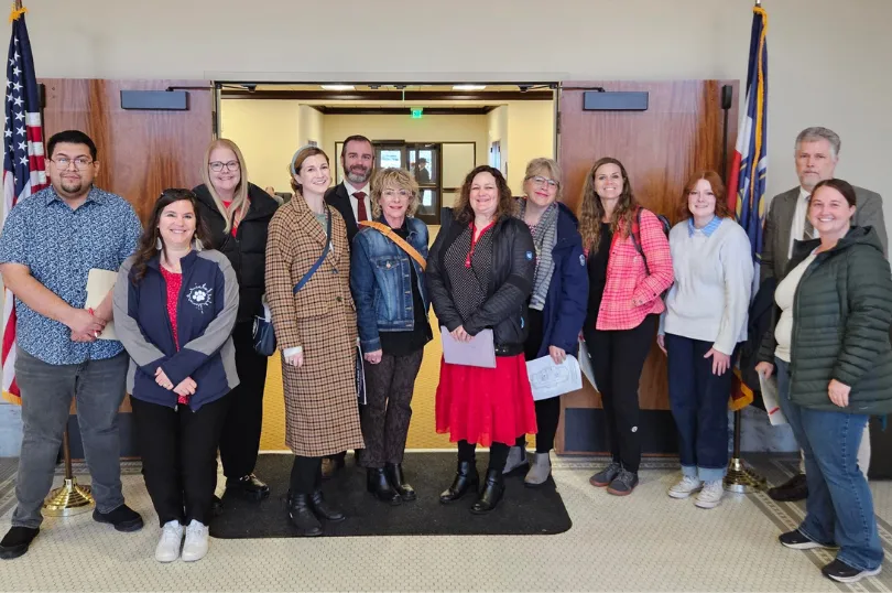 Group of people smiling.