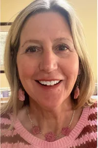 Woman with yarn jewelry.