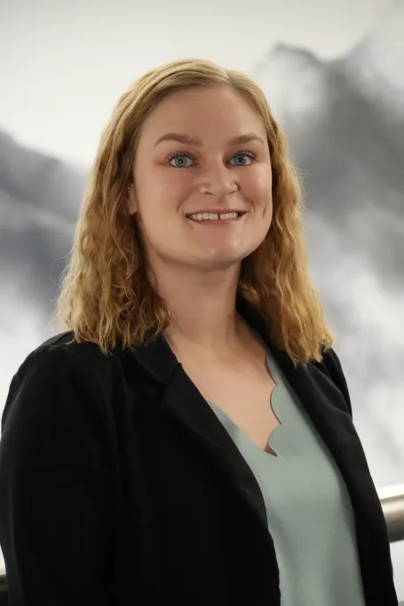 Woman smiling with blonde hair.