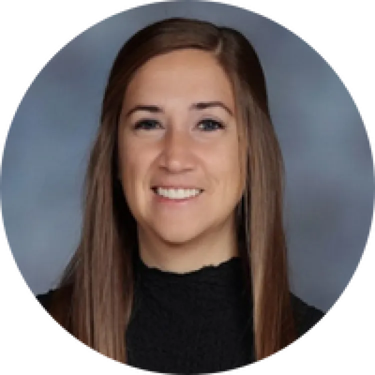 Woman smiling in black turtleneck. 