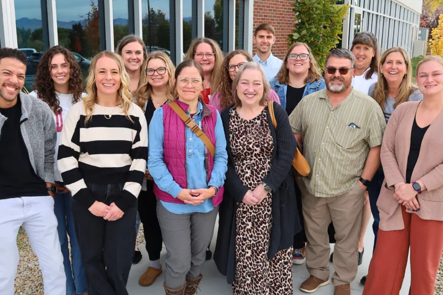 Group of UEA Policy Ambassadors smiling outside UEA HQ.