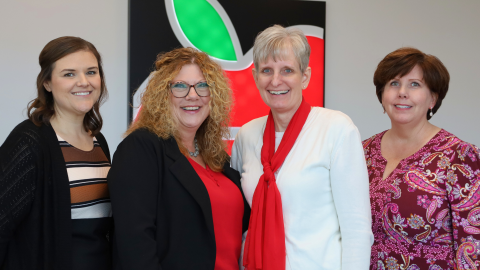 Four members of the UEA lobby team smile. 